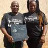 Beatrice & Pastor Sagay with the Bell Well tile & T-Shirts